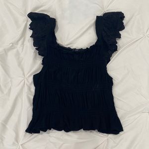 black, ruffled blouse